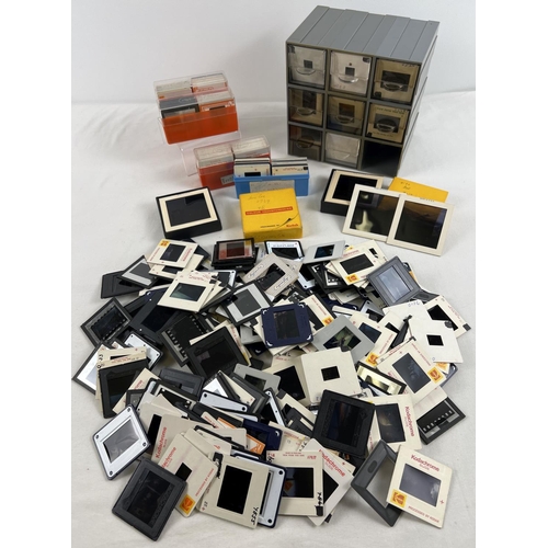 219 - A box of assorted vintage photographic negative slides.