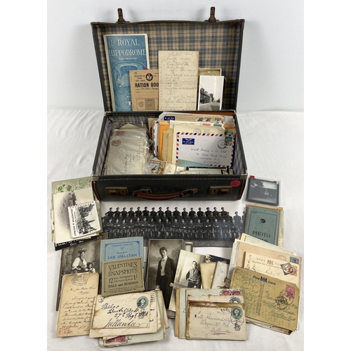 221 - A small vintage suitcase containing a quantity of assorted ephemera. To include photo's, corresponde... 