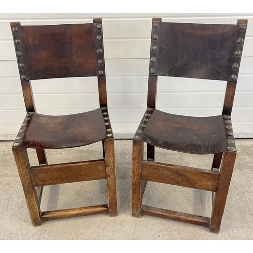 1340 - 2 dark oak Arts & Crafts style wooden block chairs with leather backs and seats. Large brass stud de... 