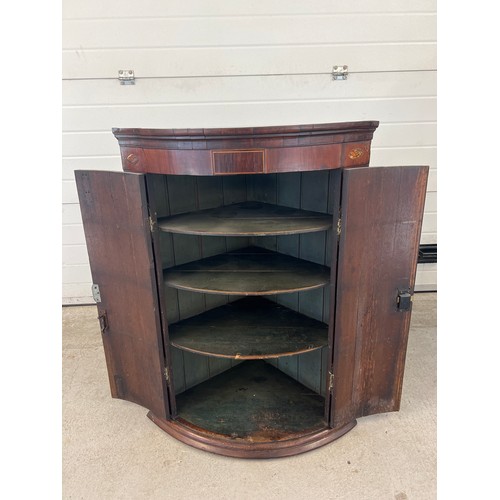 1341 - A large antique dark wood curved front corner cupboard with shell inlay decoration to top. Decorativ... 