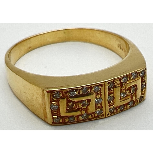 1076 - A modern 18ct gold ring with Greek key design mount set with 24 small diamonds. Stamped 750 inside b... 