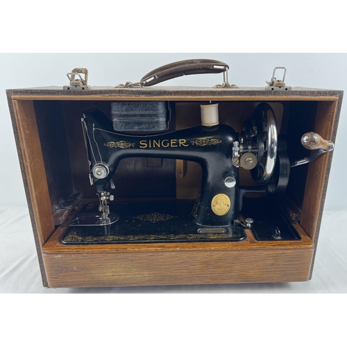 1305 - A c1950's 99K model Singer sewing machine with mock croc design wooden case. Complete with original ... 