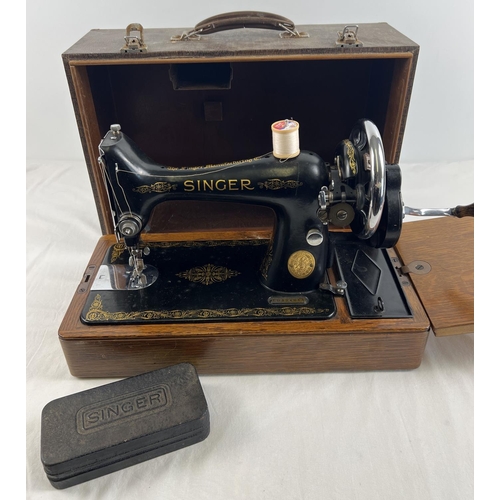 1305 - A c1950's 99K model Singer sewing machine with mock croc design wooden case. Complete with original ... 