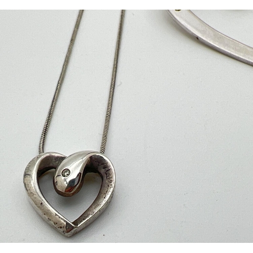 1038 - 3 items of silver diamond set heart design jewellery. A heart shaped floating pendant set with 3 sma... 