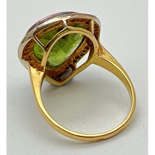 1045 - A 14ct gold peridot and diamond set cocktail ring. Central large teardrop cut peridot (approx. 18mm ... 