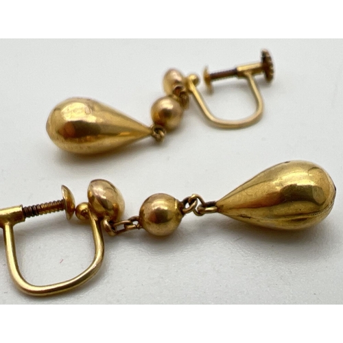 1046 - A pair of vintage 9ct gold screw back teardrop drop style earrings. Makers and gold mark to both. Dr... 