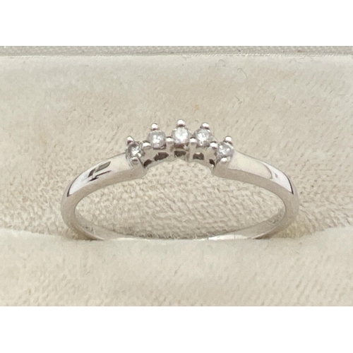 1048 - A 9ct white gold and diamond bridal set of 3 rings. Central small diamond cluster ring with 2 eterni... 