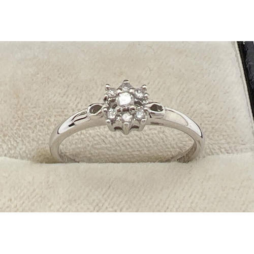 1048 - A 9ct white gold and diamond bridal set of 3 rings. Central small diamond cluster ring with 2 eterni... 