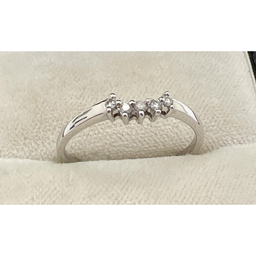 1048 - A 9ct white gold and diamond bridal set of 3 rings. Central small diamond cluster ring with 2 eterni... 