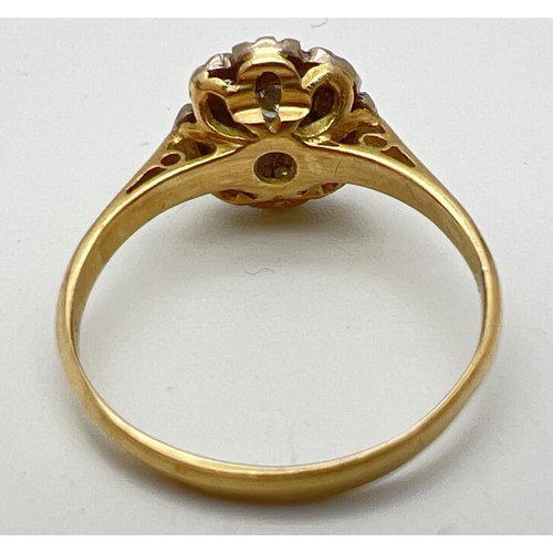 1001 - A vintage 18ct gold diamond cluster style ring set with 9 round cut diamonds. Total diamond approx. ... 