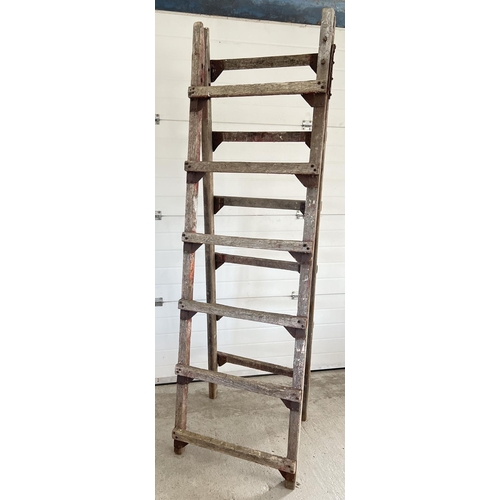 1339 - A large vintage wood folding trestle, ideal display item. Approx. 220cm tall x 66cm wide.