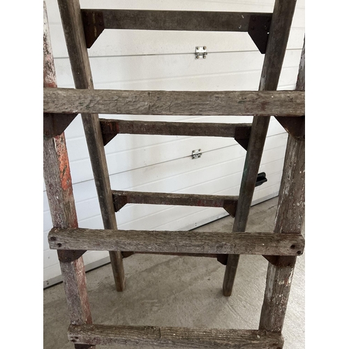 1339 - A large vintage wood folding trestle, ideal display item. Approx. 220cm tall x 66cm wide.