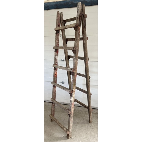 1339 - A large vintage wood folding trestle, ideal display item. Approx. 220cm tall x 66cm wide.