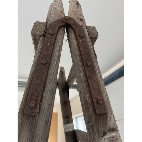 1340 - A large vintage wood folding decorators trestle, ideal display item. Approx. 216cm tall x 59cm wide.