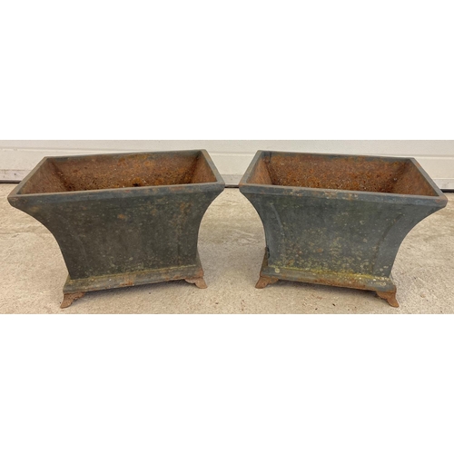 1326 - A pair of rectangular shaped cast iron 4 footed planters. Each approx. 28cm tall x 40cm long x 28cm ... 