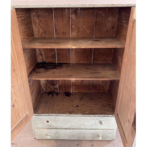 1328 - A vintage pine 2 door cupboard with 2 drawers to base, painted pale blue/green. 2 interior shelves, ... 