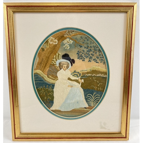 1266 - A framed and glazed fine silk embroidered panel of a Georgian lady sitting beneath a tree. In brown,... 