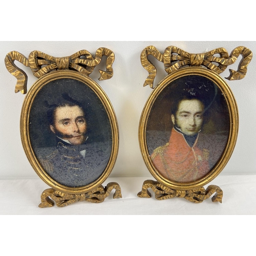 1310 - A pair of gilt framed portraits of Military men in ornamental oval frames with bow detail. Each appr... 