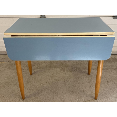 1341 - A retro mid century pale blue Formica topped, drop leaf kitchen table with 4 matching chairs. Table ... 