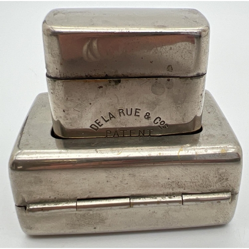 1268 - An early 20th century De La Rue & Cos travelling casket inkwell. Nickel plated inkwell with hinged l... 