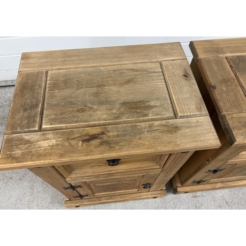 1342 - A pair of Mexican pine bedside cabinets with single drawer and cupboard. Black metal hinges and hand... 