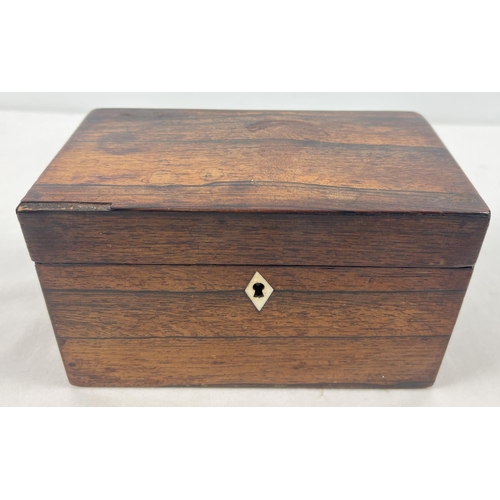 1283 - A vintage mahogany tea caddy with 2 interior compartments and diamond shaped inlaid escutcheon. Appr... 