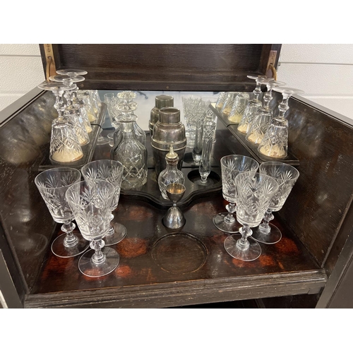 1348 - A vintage dark wood drinks/cocktail cabinet with glass and bottle compartments, 2 drawers and a coll... 