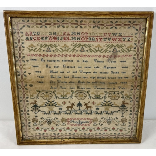 1288 - A framed and glazed Georgian embroidery sampler by Mary Saunders 1818. With the alphabet and floral ... 