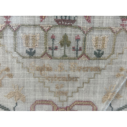 1291 - A framed and glazed Georgian fine embroidered sampler by Sophia Everton September 1835. With floral ... 