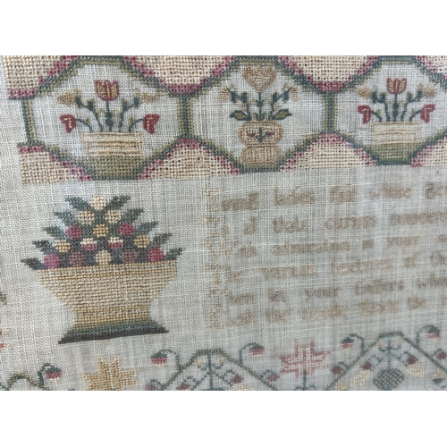 1291 - A framed and glazed Georgian fine embroidered sampler by Sophia Everton September 1835. With floral ... 