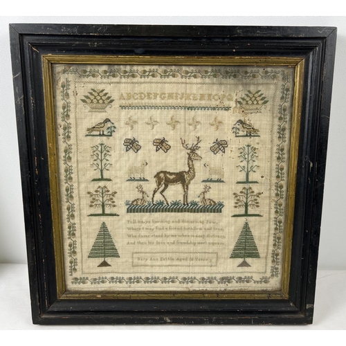 1292 - A framed and glazed antique embroidery sampler by Mary Ann Kettle aged 10. Acorn border with sheep, ... 