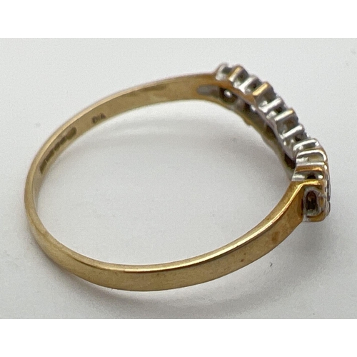 19 - A 9ct gold wishbone ring set with 7 small diamonds. Fully hallmarked inside band, and with import ma... 