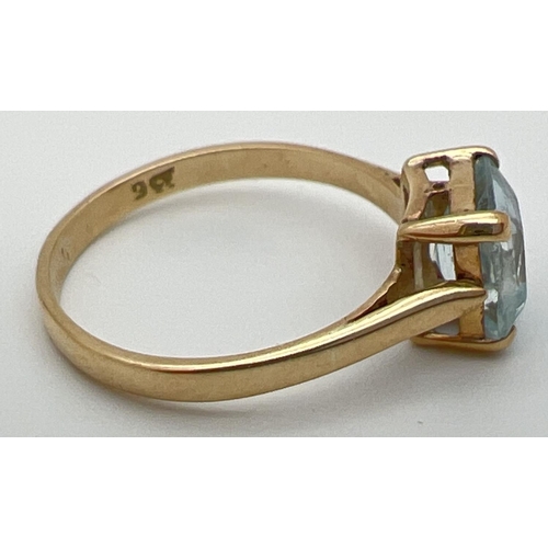 32 - A vintage 9ct gold dress ring set with large square cut blue topaz stone. Stamped 9ct inside band, r... 