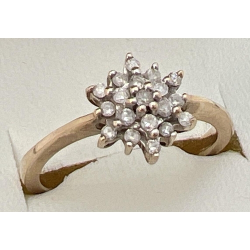 36 - A 9ct gold and diamond cluster dress ring, set with 19 small diamonds. Fully hallmarked inside band ... 