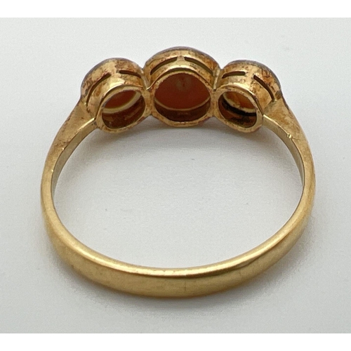 52 - A vintage unmarked 18ct gold 3 stone pearl ring, tests as 18ct gold. Ring size N.