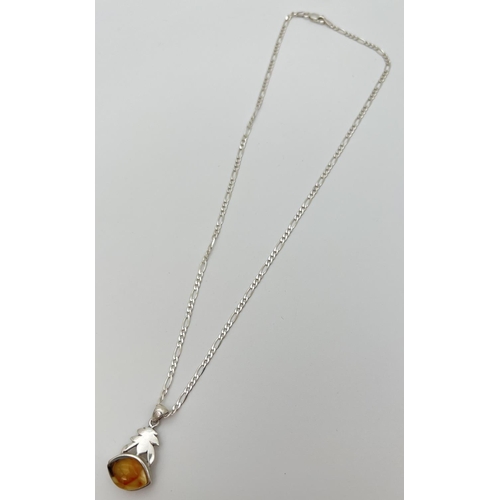 56 - A 925 silver and amber pendant on an 18