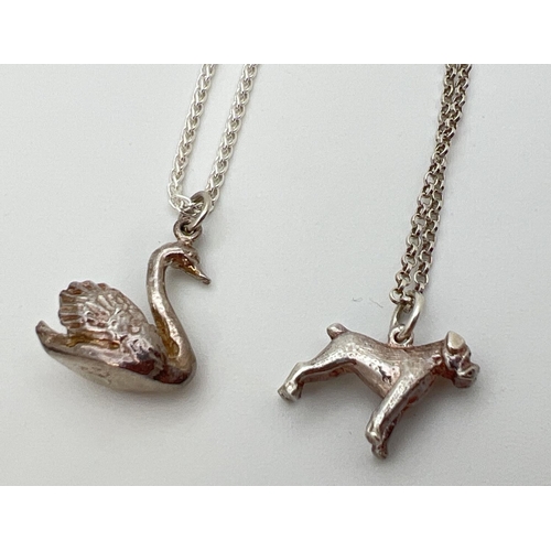 61 - 2 unmarked white metal animal shaped pendant necklaces, modelled as a bulldog and a swan. Both on 18... 