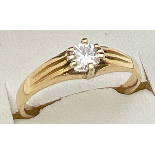 63 - A vintage 22ct gold .25 ct diamond solitaire ring with claw setting and channelled design to shoulde... 