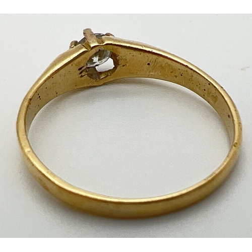 63 - A vintage 22ct gold .25 ct diamond solitaire ring with claw setting and channelled design to shoulde... 