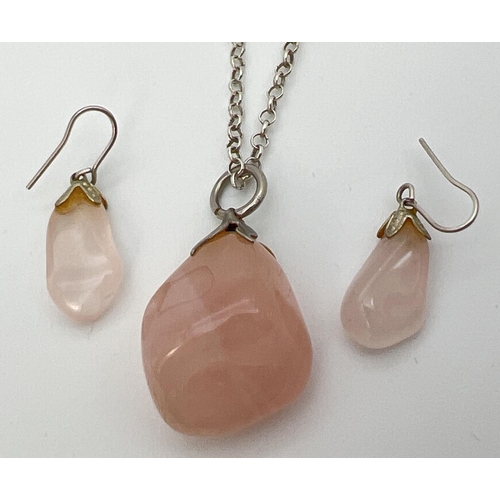 76 - A pendant of polished rose quartz on an 18