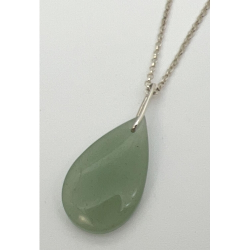 78 - A teardrop shaped jade pendant on a 16