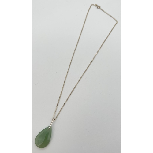 78 - A teardrop shaped jade pendant on a 16