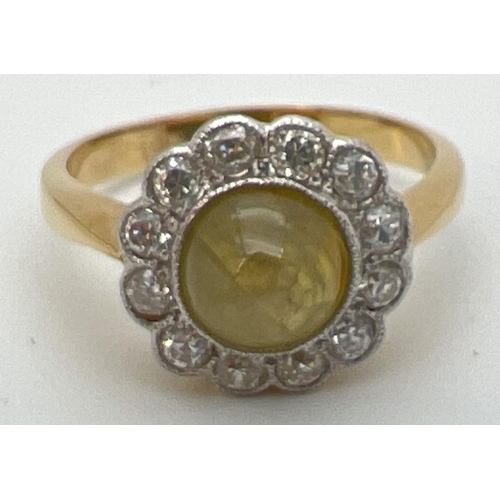 81 - An antique 18ct gold Cats eye chrysoberyl & diamond ring. Central circular cats eye cabochon surroun... 