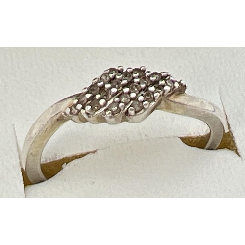 84 - A 925 silver and diamond cluster ring with a diamond shaped mount. Stamped 925 inside band, ring siz... 