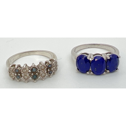 85 - 2 modern silver gemstone set dress rings. A Genuine Gem Company blue stone trilogy ring, Stamped 925... 