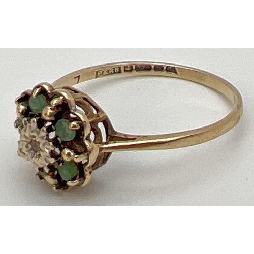 87 - A vintage 9ct gold emerald and diamond cluster ring in an open work setting. Central illusion set di... 