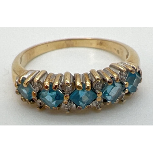 88 - A 9ct gold eternity ring set with 5 square cut London blue topaz stones interspersed with small diam... 