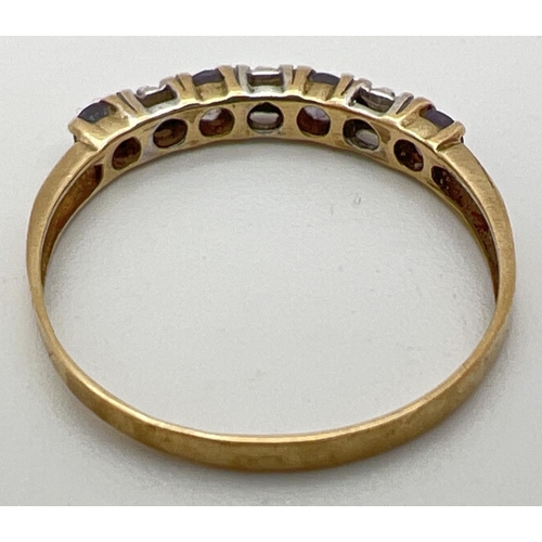 92 - A small 9ct gold eternity ring set with alternating amethysts and diamond chips. Stamped 375 inside ... 