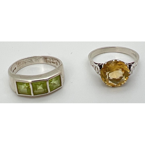 103 - 2 silver stone set rings. A 3.5ct round cut citrine in a cathedral style mount and a peridot trilogy... 