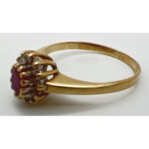 40 - An unmarked 9ct yellow gold, ruby and diamond cluster ring in a high mount. Central oval cut ruby (a... 